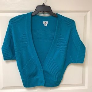 Women’s teal cardigan.